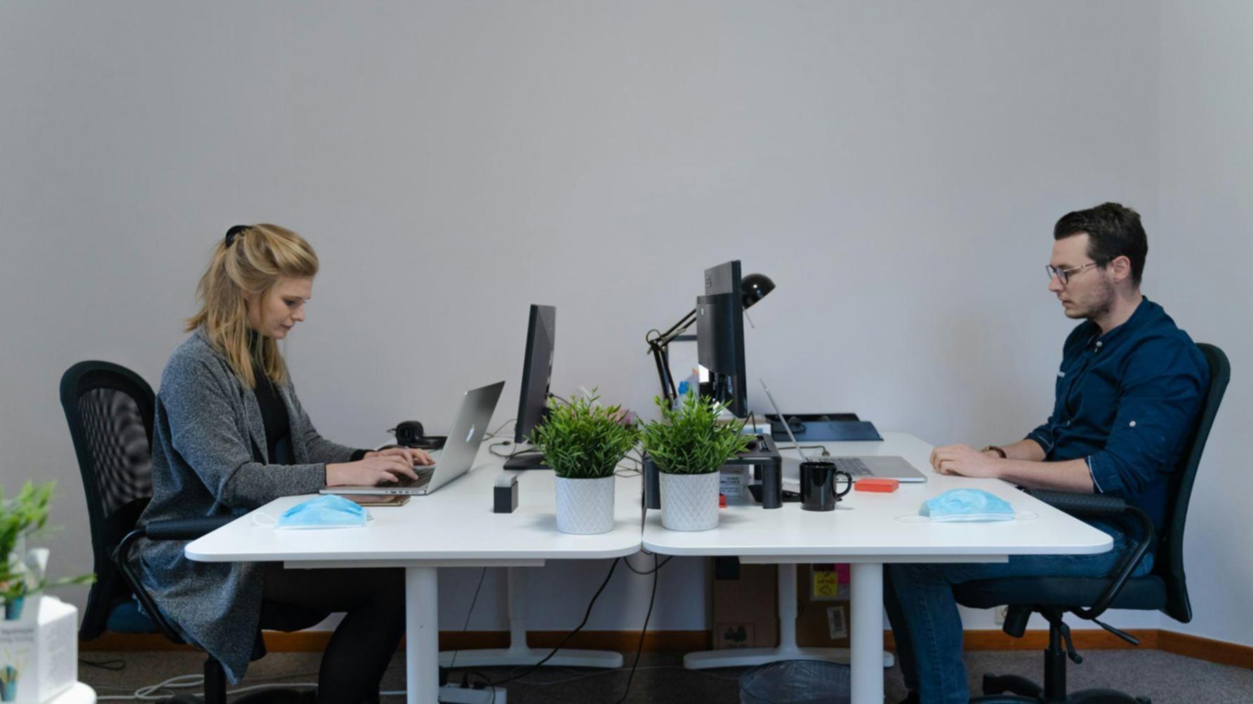 Collaborative workspace showing finance professionals working together on analytical projects